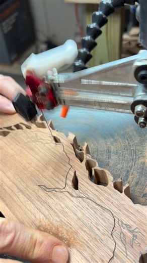 Steve Griffin on Instagram: "Scrollsawn from ebiara and curly maple, the tree and her dress emerge from the grain like memory from silence. The wood itself holds light differently — soft, shifting, alive — just like she was. Every cut follows the shape of remembering. Part of the Orchard of Remembering series. #scrollsawart #curlymaple #memorialart #woodandmemory #handcut orcharsofremembering finewoodworking symbolicart griefintocraft storythroughmaterial"