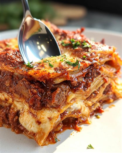 Beef Short Rib Ragu Lasagna with Béchamel Sauce Treat yourself to the cozy indulgence of Beef Short Rib Ragu Lasagna with Béchamel Sauce, a luxurious dish designed to make any dinner feel special. Layers of tender, slow-braised beef short ribs, velvety béchamel, and delicate pasta come together beneath a golden blanket of melted mozzarella for the ultimate comfort meal. Ingredients For the Ragu: 3 lbs beef short ribs 28 oz canned crushed tomatoes 1 large onion the heat and let it gently simmer f