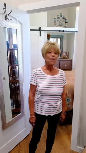 Her 399 sqft tiny home with the bedroom on the main floor. The major perks of this design - standing room, a queen size bed, built in storage, and not one, but TWO amazing closets in her bedroom. | Tiny Home Tours