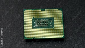 Computer CPU chip rotating - close up video. Shallow field of view. Macro shot of technology background.