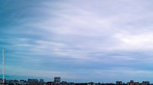 Fast Continuous Cloud Cover over City Rooftops. Time Lapse