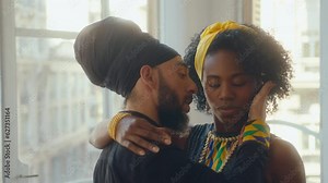 Sensual tango partners leaning in close, embracing, touching cheeks and looking with temptation while feeling each other during dance in studio