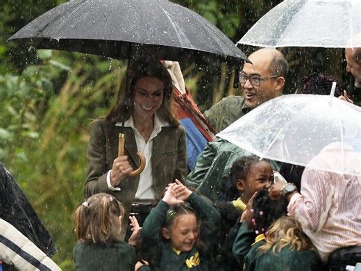 Kate debuts blonde look as she leads schoolchildren out of rainstorm
