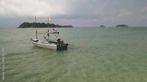 Drone view: flags flying over the yacht in the ocean beach, yachting competitions