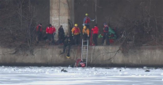 Woman taken to hospital after vehicle plunges into icy river