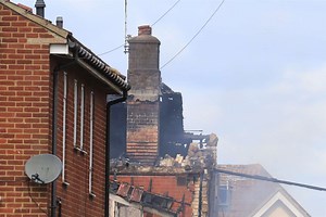 Seven injured as explosion leaves gaping hole in row of houses