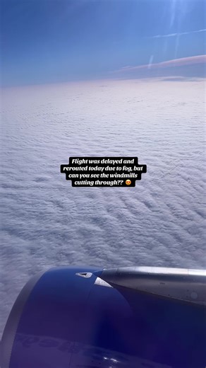 Stunning Window View of Windmills During Flight Delay
