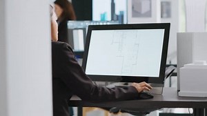 Technician operating on cad software to create blueprint for new architectural scaling project, using industrial elements in coworking space. Developer designing creative sketch. Handheld shot.