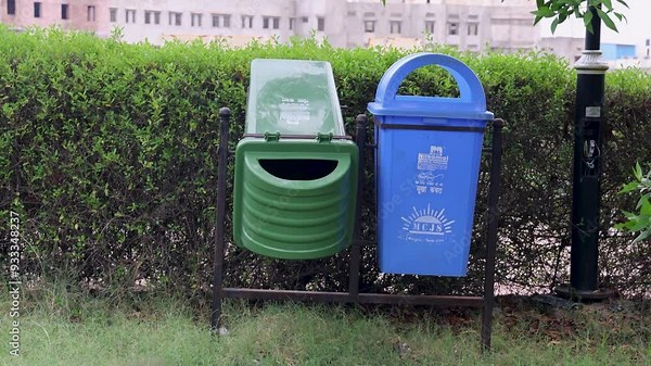 isolated dustbin for wet and dry at outdoor park at evening Stock Video