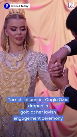 Bride struggles to move under weight of gold at extravagant engagement ceremony