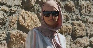 A Woman Wearing a Hijab And Sunglasses