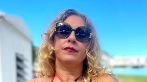 American Pickers' Danielle reveals bare butt in thong bikini on beach trip