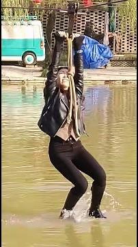 Sexy wet high boots and fall into water