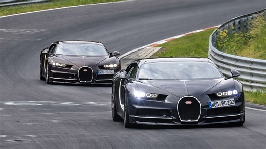 Two Bugatti supercars racing on the Nürburgring track
