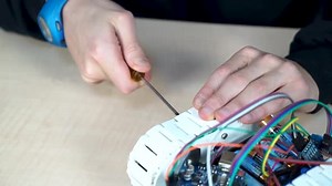Boy Builds Robot Car in Robotic Coding Lesson in Primary School