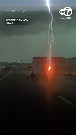 Lightning bolt narrowly misses truck on freeway