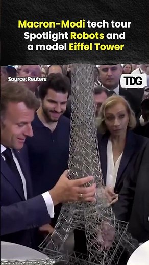 Robots and a Model Eiffel Tower Greet Macron, Modi at Paris Tech Conference