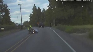 Biker survives head-on crash with cop car in Oregon