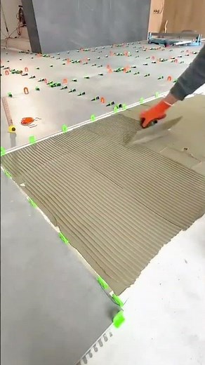 Installing ceramic floor tiles using leveling spacers