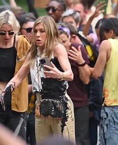 Viral Video | Jennifer Aniston recently found herself in a messy situation while filming "The Morning Show" in New York City. Photos and videos captured the Friends actress, who plays Alex Levy, getting soaked in oil during a protest scene. In the scene, her character becomes entirely covered in a black liquid. Although this was part of the shoot, Jennifer appeared visibly angry as extras turned away from the spill. #TheAssamTribune #ViralVideo #JenniferAniston | The Assam Tribune