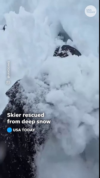 Terrifying video shows skier dug out from deep snow