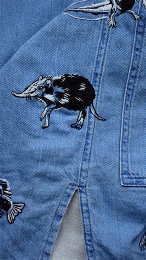 Sara aka Bear&Bean on Instagram: "I’m back in the groove with my 52 Weeks to Ms. Frizzle project! Here’s the reveal of my elephant shrew embroidery, which found its home near one of my other favorite stitched animals in this project: the axolotl. The elephant shrew marks week 29 of my ongoing 52 Weeks to Ms. Frizzle project, in which I am stitching a new wild animal on the same dress for every week of a year. Watch on to learn more about the elephant shrew, particularly why their name is fitting