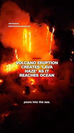 Volcano eruption creates 'lava haze' as it reaches ocean
