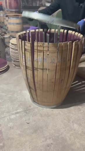 Restoring old barrels involves breaking them down, sanding away years of wear, and preparing them for future use. The wood is carefully refinished, with fire charring used to enhance its durability and seal the surface. By preserving their strength and quality, these barrels are transformed for a renewed purpose. 🎥@tanoariasomethingrustic . . . . . #thewinecrate #winemakerslife #cooperage #coopers #barrels #oakbarrels #winebarrels #casks