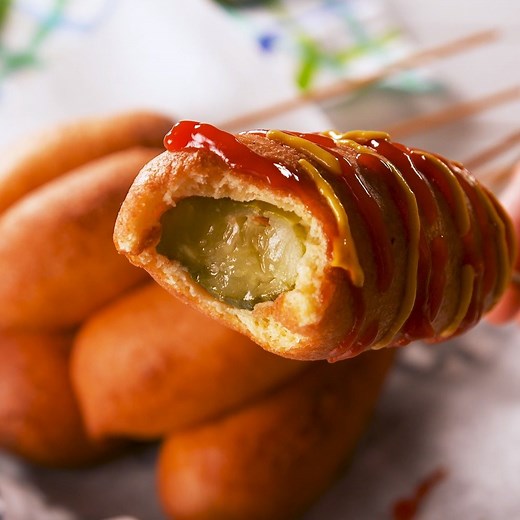 PICKLE Corn Dogs—too far or not far enough? Full recipe: http://dlsh.it/GkJMZ5l | Delish