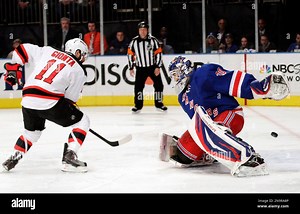 New Jersey Devils' Stephen Gionta (11) scores past New York Rangers goalie Henrik Lundqvist, of Sweden, during the first period of Game 5 of an NHL hockey Stanley Cup Eastern Conference final playoff series, Wednesday, May 23, 2012, in New York. (AP Photo/Frank Franklin II Stock Photo - Alamy