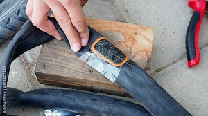 make bicycle tire repair, a person is repairing a puncture bicycle inner tubes, Stock Video