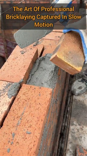 Expert Mason Demonstrates Perfect Technique On A New Wall