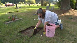 Woman cleaning hundreds of gravestones at Washington cemetery
