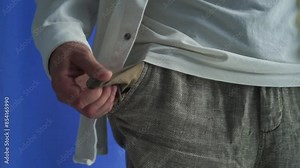 empty pockets in shirts. The man shows that he has no money. Gestures of a man who has no money