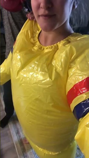 Girl inflating her plastic suit