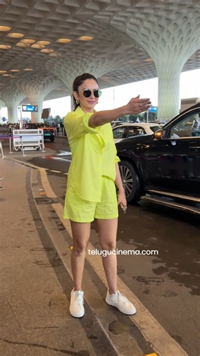 Rakul Preet Singh was spotted at Mumbai airport, looking effortlessly chic in fluorescent casual shorts paired with a matching shirt. | Telugu Cinema