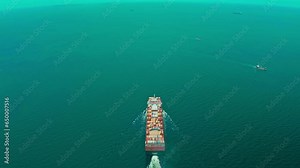 4K resolution high angle view of a container ship sailing at the sea for transportation.