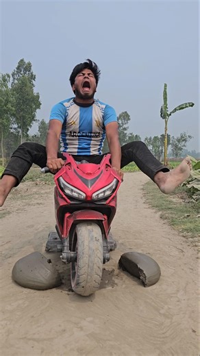 A little boy i's having fun with his small motorcycle?