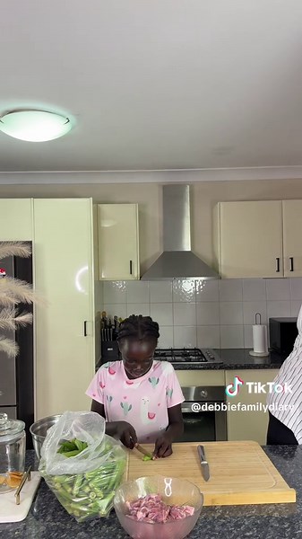 In the kitchen with my daughter 😍 cooking okra #debbiefamilydiary #letscook #cookingvideos #momlife #kidsinthekitchen #okrasoup #cookingmotivation #fypcooking