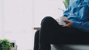 Download Happy senior couple using remote control to change channel. Seniors watch TV for entertainment while man using remote control. Wife and old man sitting on couch in living room with television show. for free