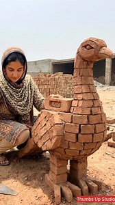 A girl shaping a bird from red bricks #artwork #fblifestyle #crafts | Thumbs Up Studio