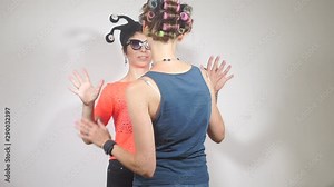 two lesbian girlfriends hold hands when meeting in the toilet