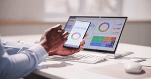 KPI Business Analytics Data Dashboard. Analyst Using Computer