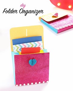 DIY Folder Organizer | Paper Holder | Back To School Supplies Needed: Glitter Paper Ruler Marker Scissor Embossing Tool Glue Pearl Learn how to make a useful accordion folder! You can make a rectangular one or square one, great for storing documents, receipts & photos. This is one way to make an expanding document folder. You can create little tabs for them or draw them on the inside. Use some flip to close the folder or you could create a cover that goes over the top and fastens. The base is an