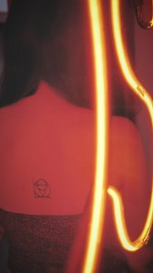 Girl in neon sign - Free Stock Video