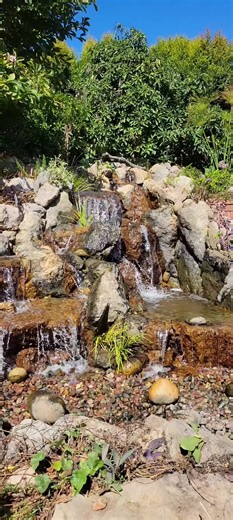 At DreamScapes, we encourage people to Live the Aquascape Lifestyle by incorporating shallow POOLS in the STREAMS of our PONDLESS WATERFALLS! #landscapedesign #waterfeatures #pondlesswaterfall #DreamScapes