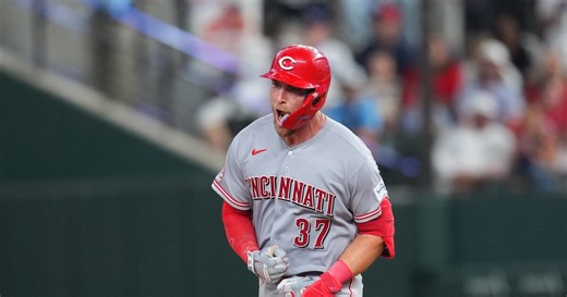 Reds beat Rangers 5-3 in their 1st road game with 3 homers, the last in the 9th