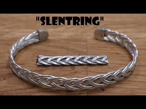 Fingerloop braiding a silver bracelet.