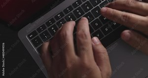 4K Video close up top view hand typing on keyboard notebook. Concept for coding and technology.