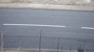 Traffic cars passing by on a large street in a beautiful scene